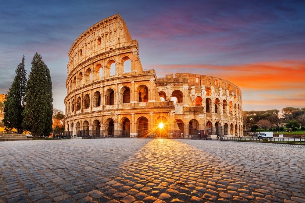 The Colosseum Amphitheater with the sunrise through the entranceway.