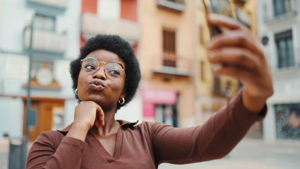 Young woman taking a selfie.