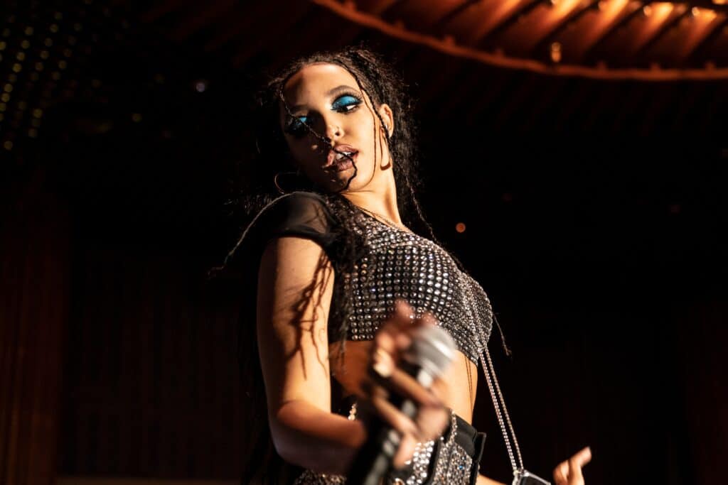 Close up of Tinashe dancing on stage.