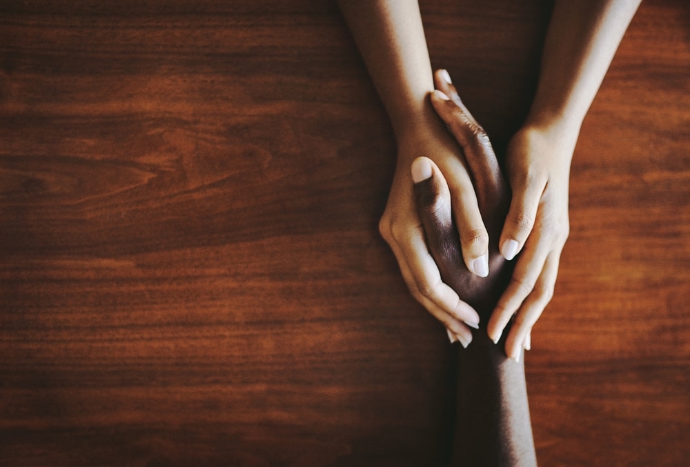 two hands gripping eachother