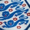 Three lions badge on an England shirt.