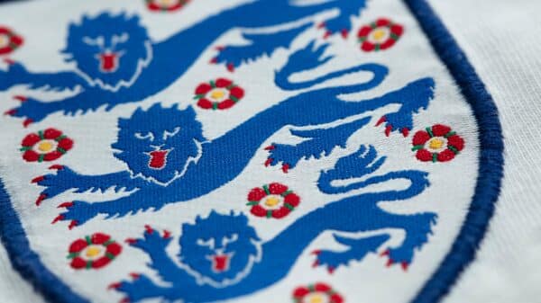 Three lions badge on an England shirt.