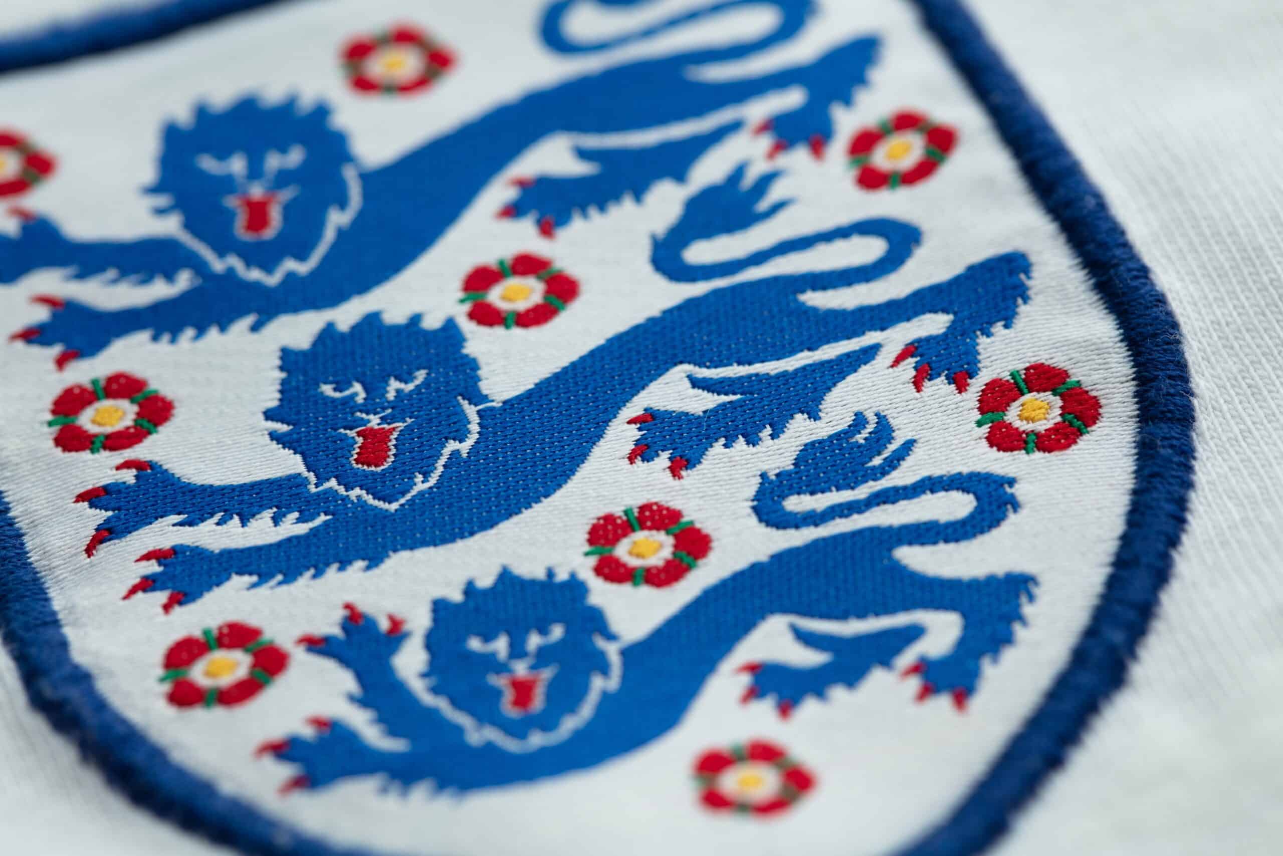 Three lions badge on an England shirt.
