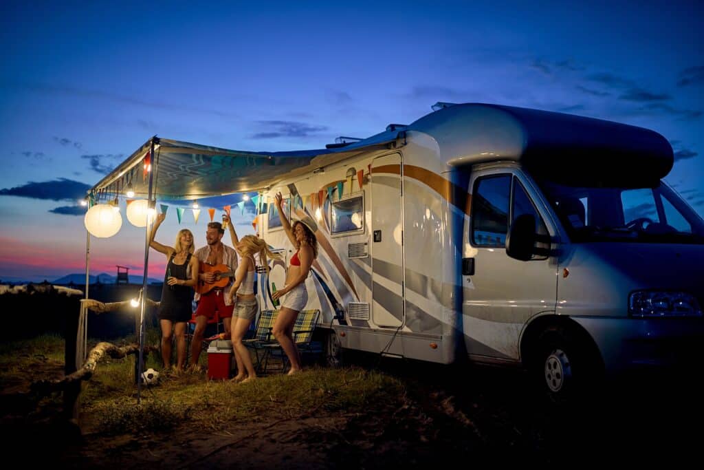 friends having fun camping in the summer