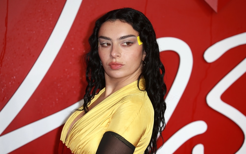 Landscape portrait of Charli XCX in a red carpet