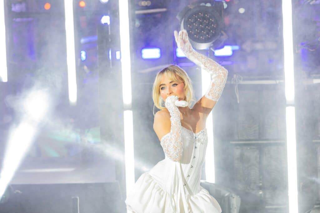 Sabrina Carpenter singing on stage