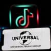 Universal logo projected in an iPhone screen infront of a TikTok logo