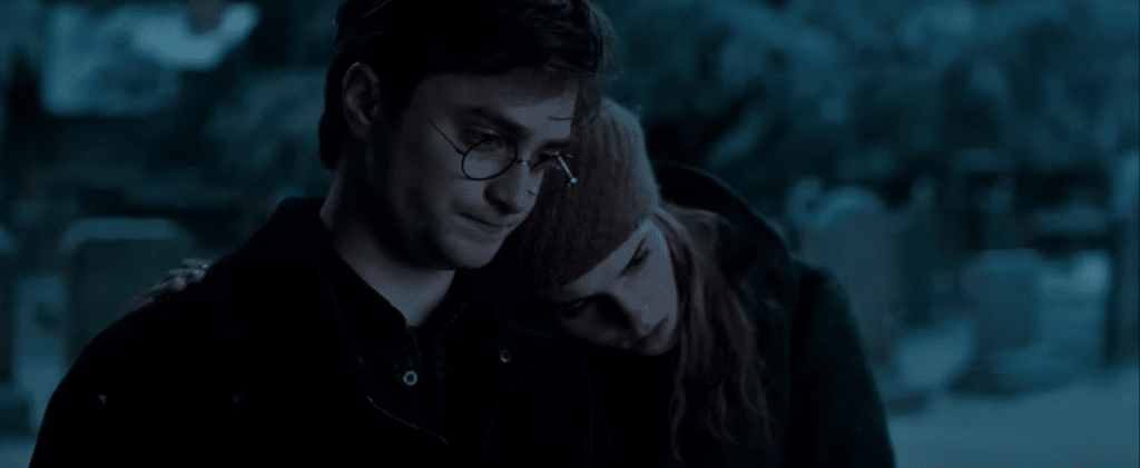 Harry Potter and Hermione in a grave yard.