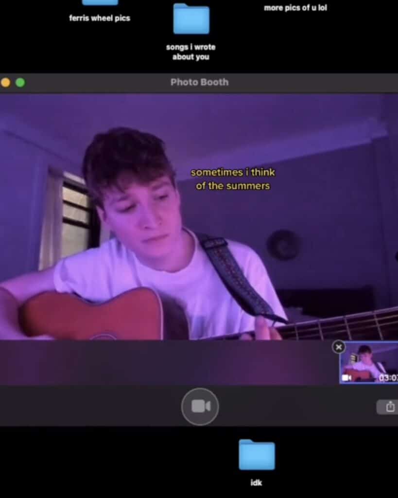 An image of Kevin Atwater selected from his TikTok. He is playing one of his songs on guitar.