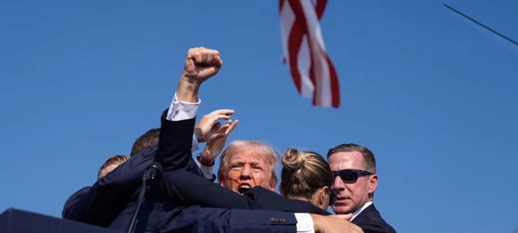 Donald Trump pumps fist after shooting. Credit: YouTube/Sky News