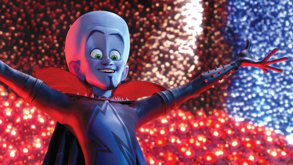 Megamind with his hands up in the air in celebration.