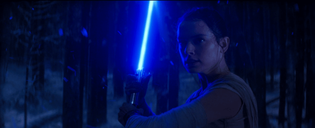 Rey wielding Luke Skywalker's lightsaber in her fight against Kylo Ren in The Force Awakens the first of Disney's Star Wars sequel trilogy.