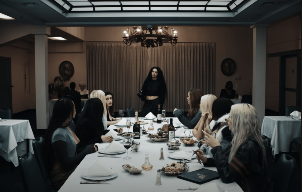 A screenshot of Charli Xcx and a group of notable figures in the music video for "360".