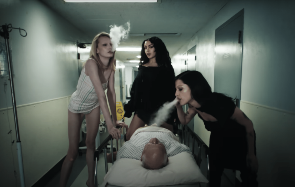 A screenshot of Charli Xcx with Alex Consani & Gabriette in the music video for "360".