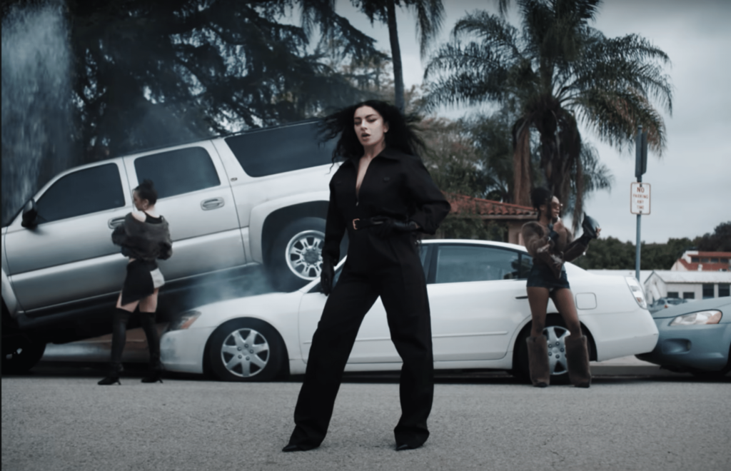 A screenshot of Charli Xcx, Quenlin Blackwell, and Emma Chamberlain in the music video for "360".