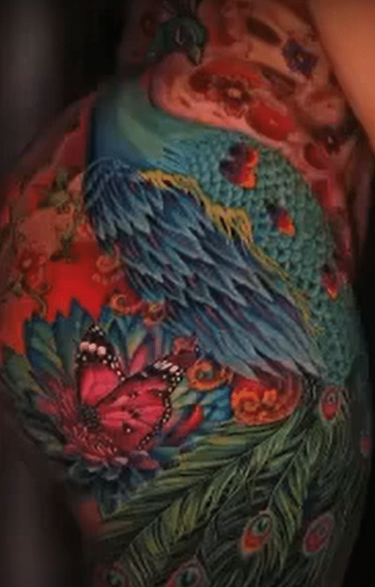 Cardi B's thigh tattoo of a peacock.