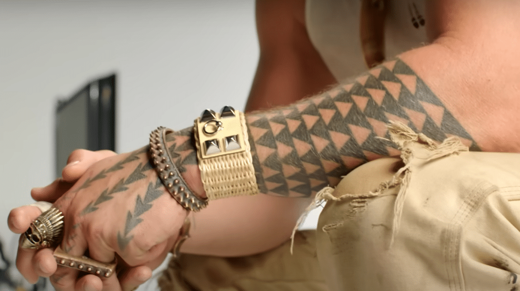 Jason Momoa's tribal shark teeth tattoo on his left arm.