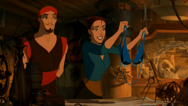 A man stands next to a woman holding a blue bra.