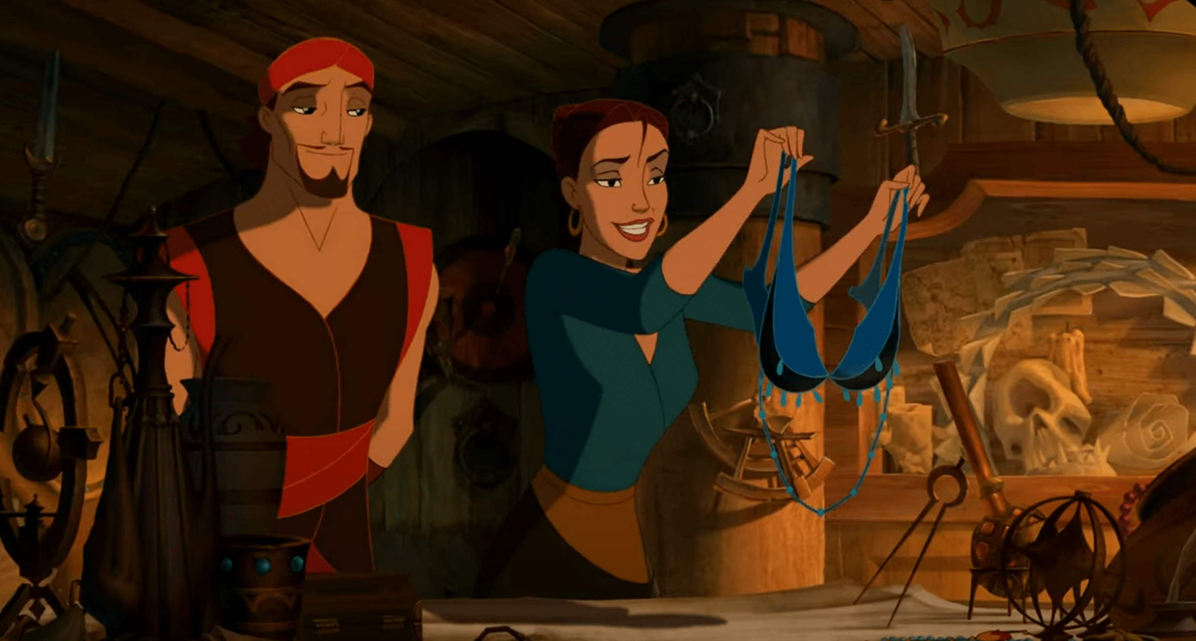 A man stands next to a woman holding a blue bra.