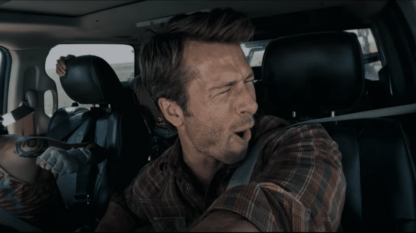 From left to right: Sasha Lane and Glen Powell "wrangling" a tornado. Credit: YouTube/ONE Media +