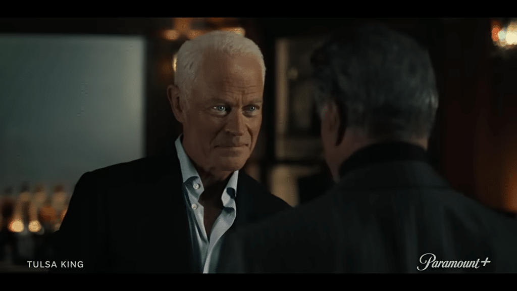 Neil McDonough looking Sylvester Stallone in the eyes menacingly in the Tulsa King season 2 trailer.