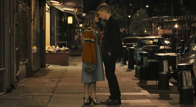 Two main characters from movie "About Time" about to kiss.