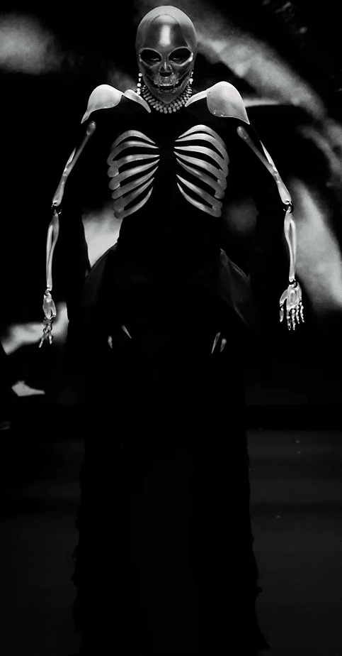 A black dress with a skeleton face, ribs, and arms.