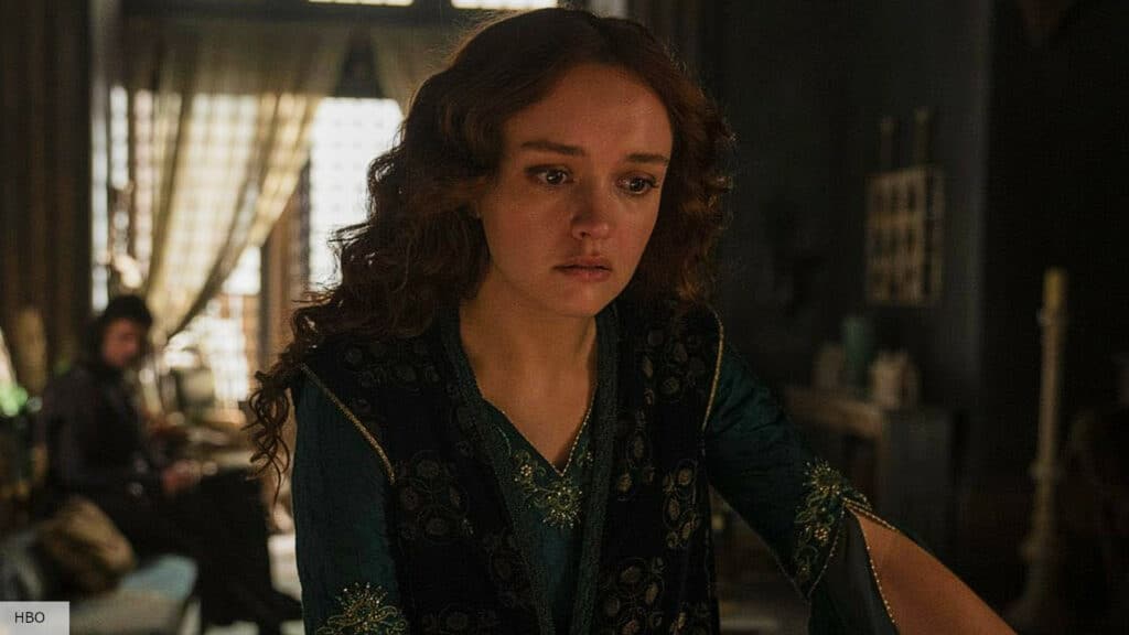 A distressed-looking Alicent, standing with her back to Larys Strong.