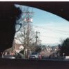 A man looks out the window of a car towards Seattle's Mount Rainier