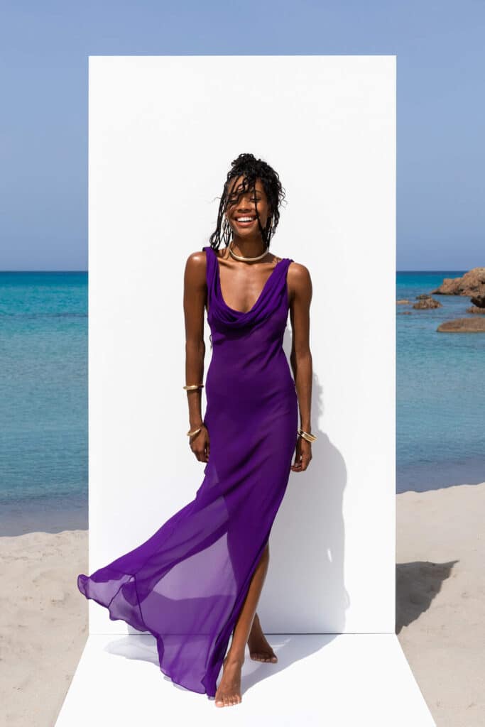 Woman in a purple dress from Rat and Boa.