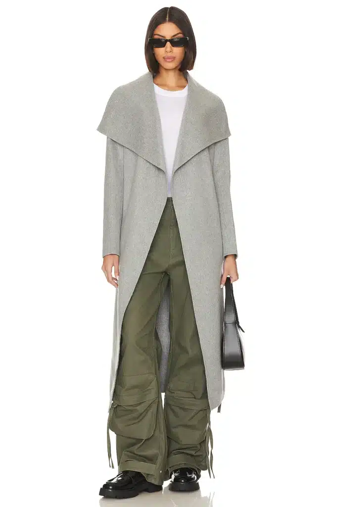 Woman in a long grey coat from Revolve.