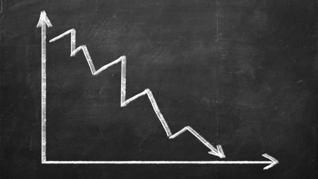 Declining graph on a blackboard.