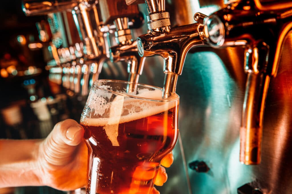 Beer being poured at a bar