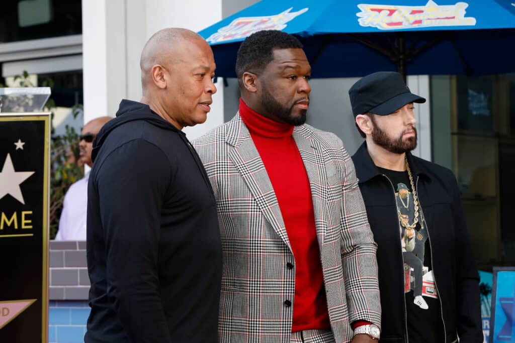 From left: Dr. Dre, 50 Cent, and Eminem at 50's Star ceremony. Credit: Shutterstock/Kathy Hutchins