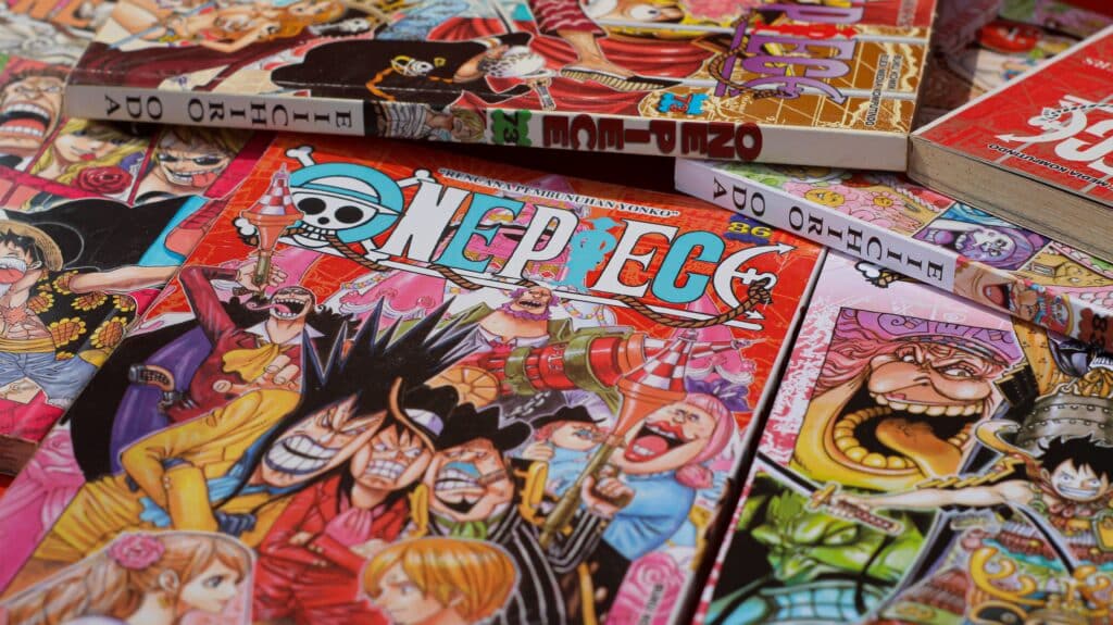 Japanese Manga One Piece - comic book published in Weekly Shonen Jump Magazine. Isolated in Red Background.