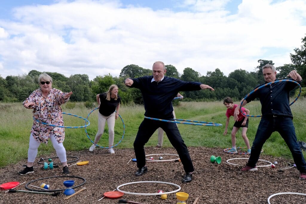Ed Davey has a go with a hula hoop in Edinburgh
