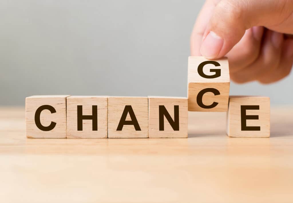 wooden blocks spelling out "change" and "chance"