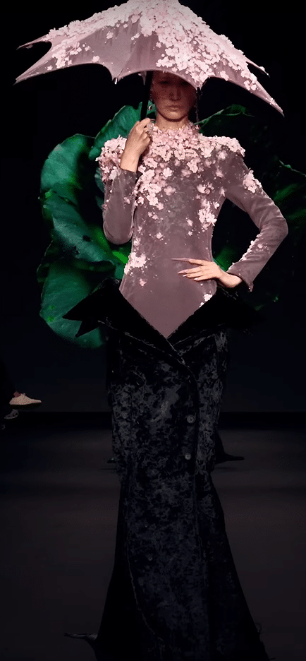 A dress made of cherry blossoms with a purple undertone and black. A matching umbrella too.