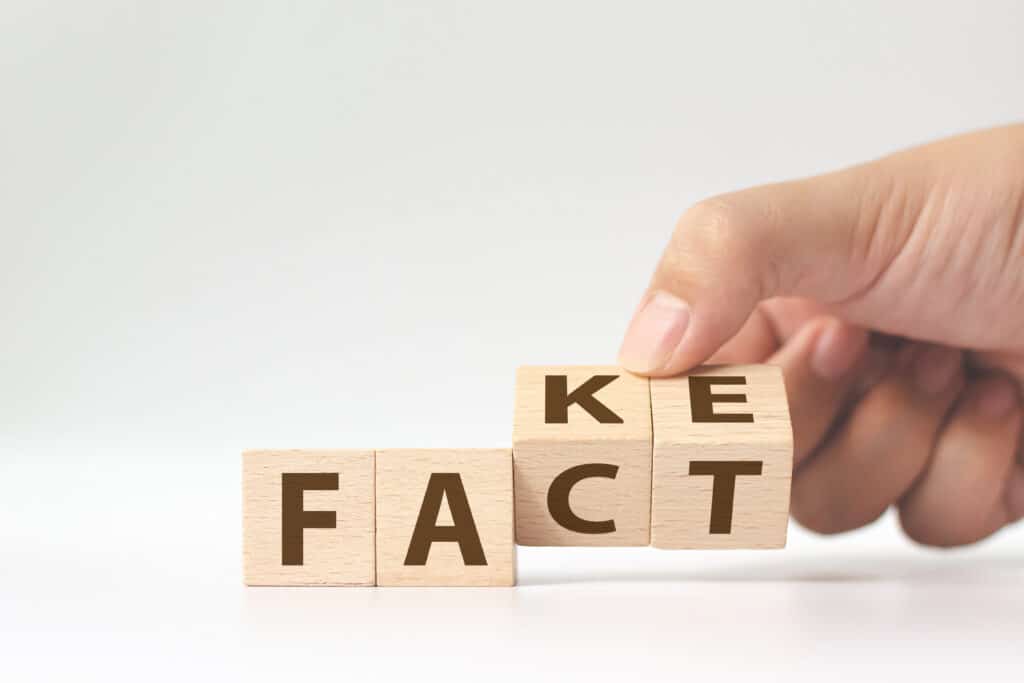 Scrabble letters used to form the words "fact" and "fake." Time to play Sunscreen true or false!