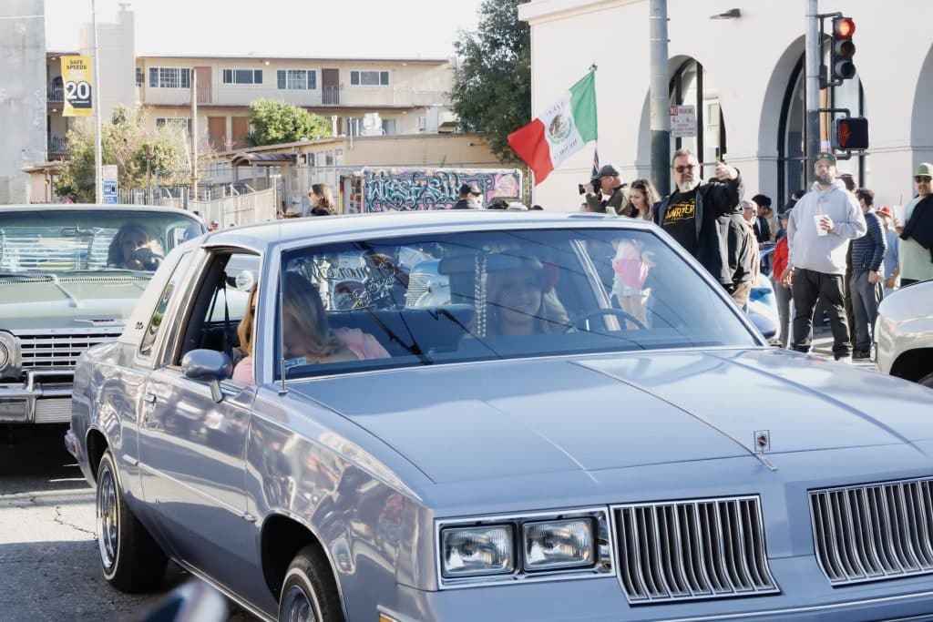 2 girls in light blue lowrider.