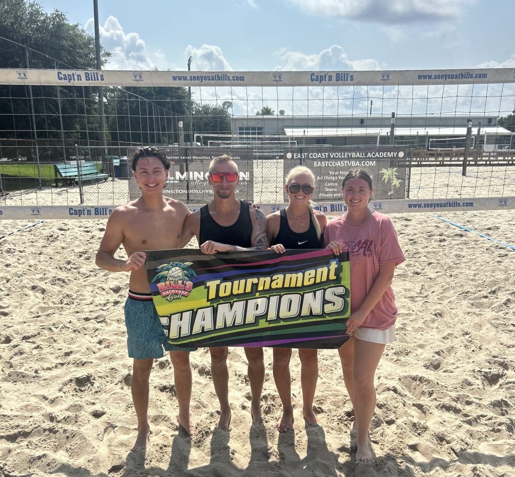 Players holding a banner after winning Capt'n Bill's tournament.
