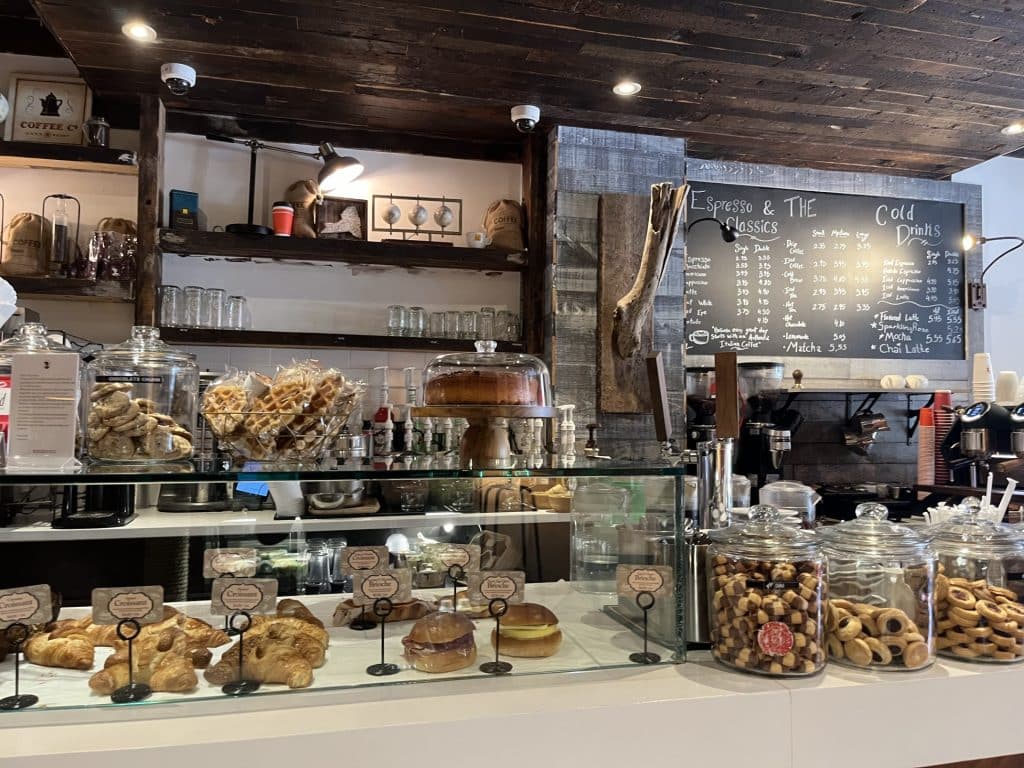 Charlotte's cafe line of croissants, pastries, cookies, waffles, and breakfast sandwiches.