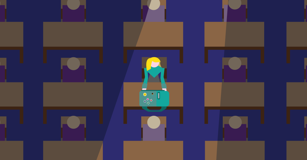 a girl in a classroom adding stickers and things to her backpack