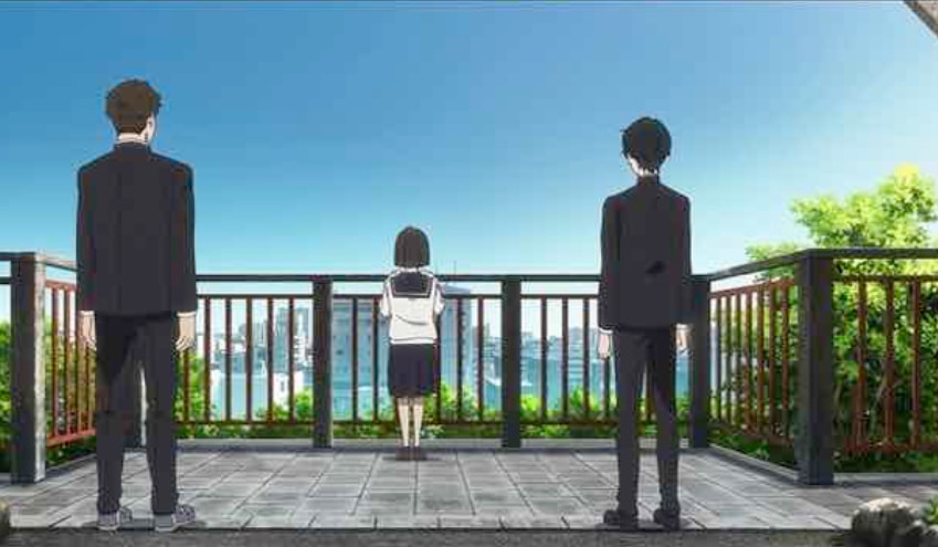 Kobato and Kengo stand back to us and watch Osanai as she leans on railing, facing the city beyond.