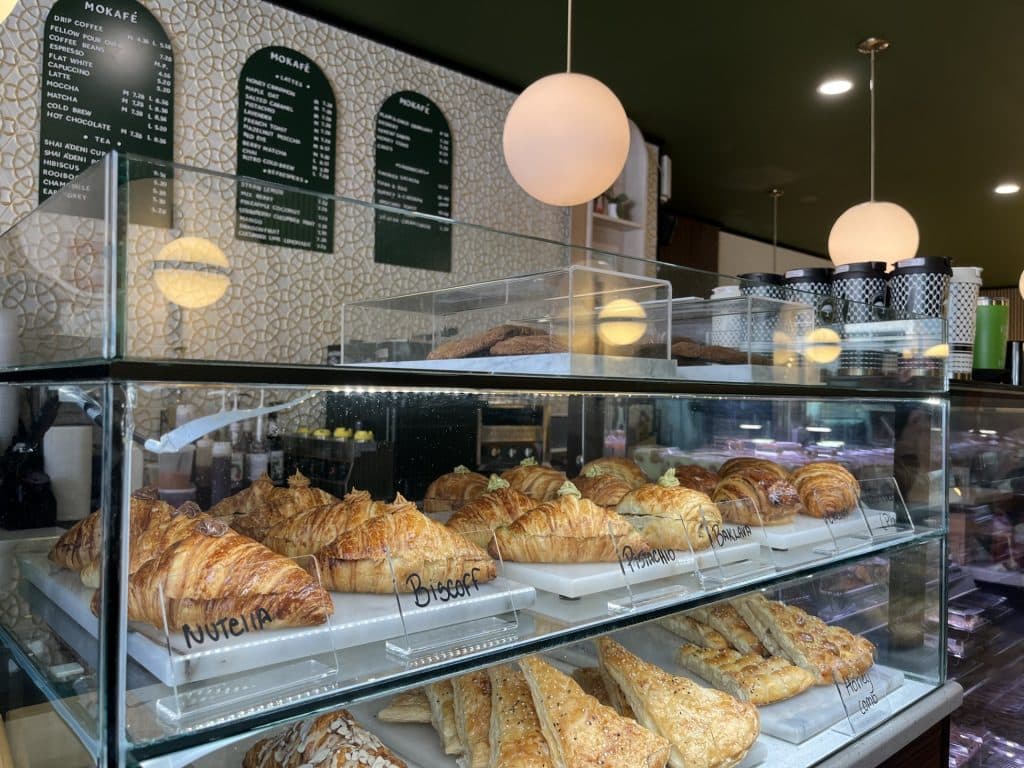MOKAFÉ's croissants, pastries and the front of their cafe.