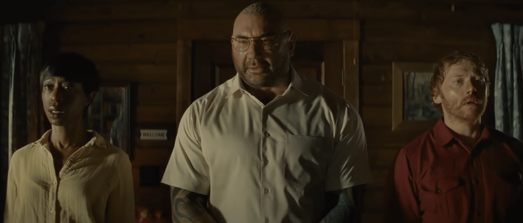 (From left to right) Nikki Amuka-Bird, Dave Bautista, and Rupert Grint in M. Night Shyamalan's Knock at the Cabin.