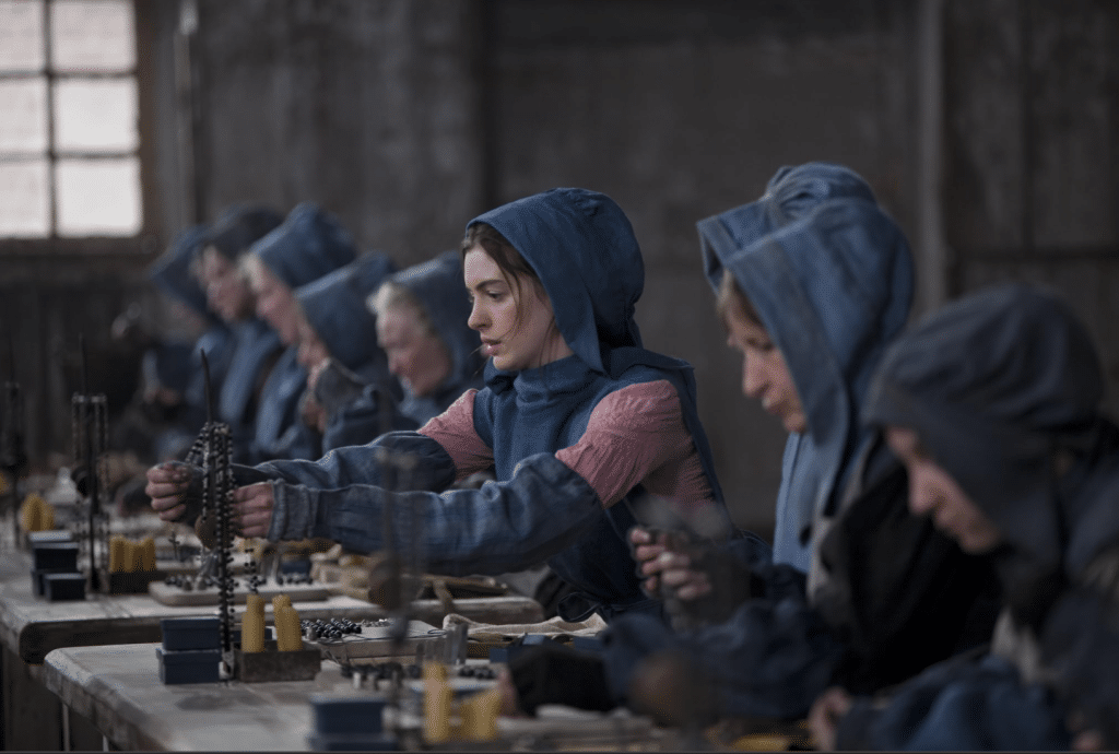Still from Les Misérables, where Fantine (played by Anne Hathaway) is working.
