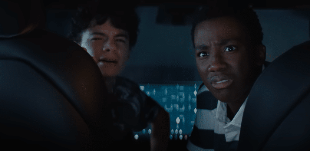 Connor (Raphael Alejandro, left) and Eddie (Ramon Reed) are disgusted by what they see in the car. Credit: YouTube/Netflix
