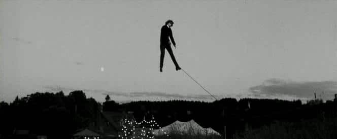 Jude Quinn (Cate Blanchett) suspended in the air.