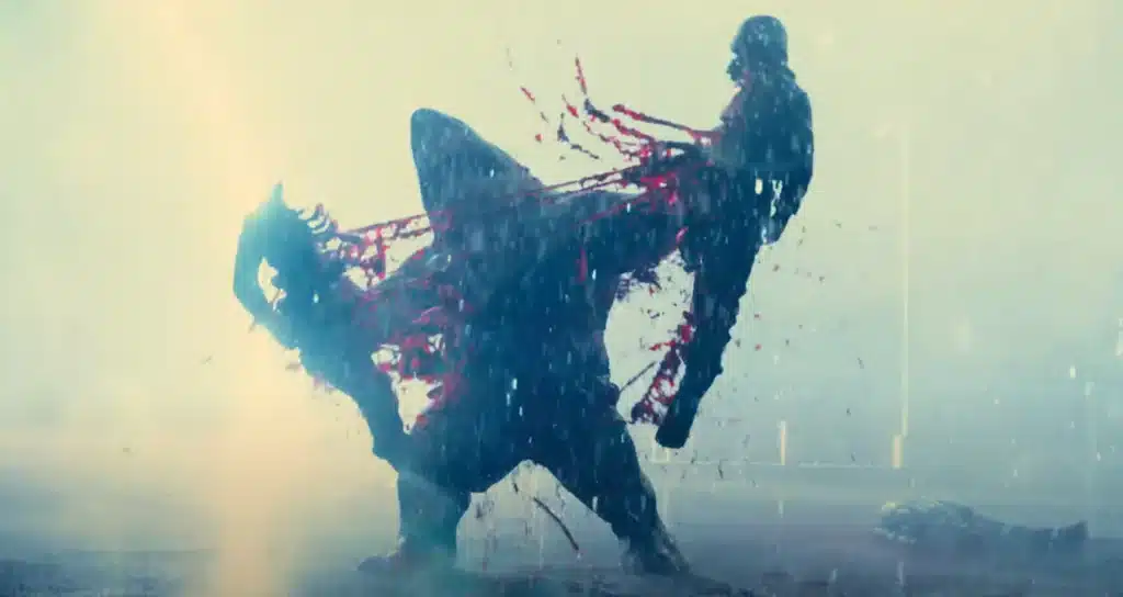 King Shark from Suicide Squad (2021) is ripping a soldier in half